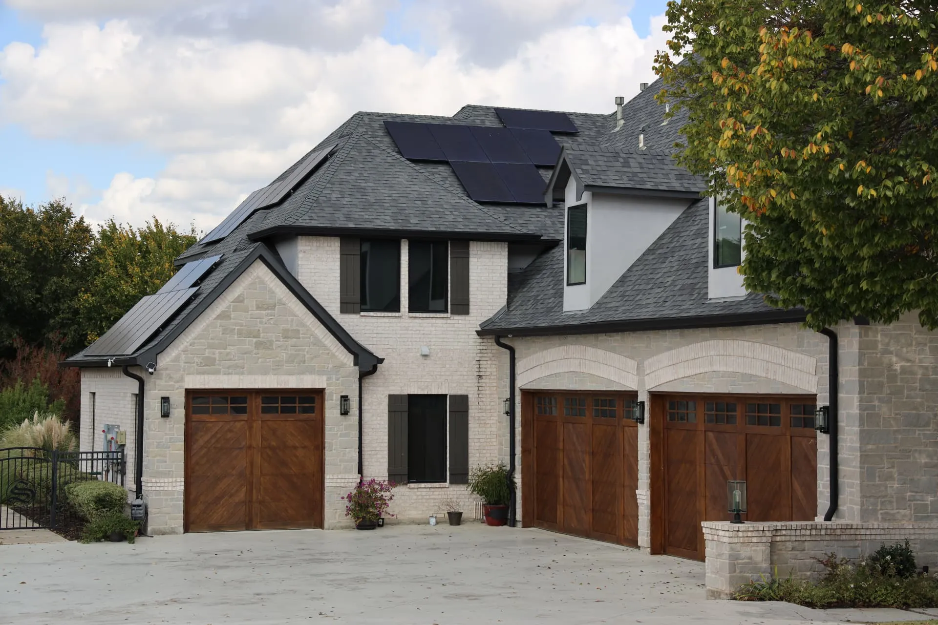 Shingle roof and solar panels above the garages of the Prosper project