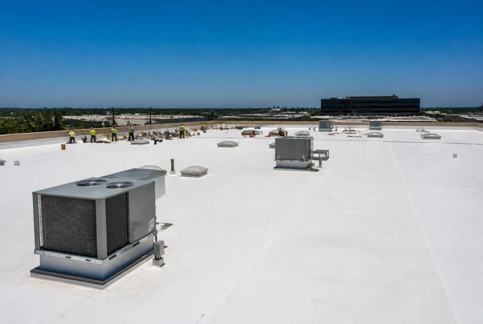 White TPO membrane roof with rooftop HVAC units on a DFW commercial building