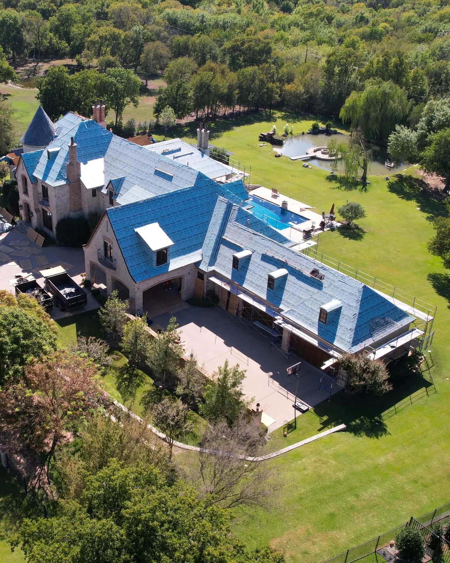 Flower Mound home with a traditional roofline and established landscaping