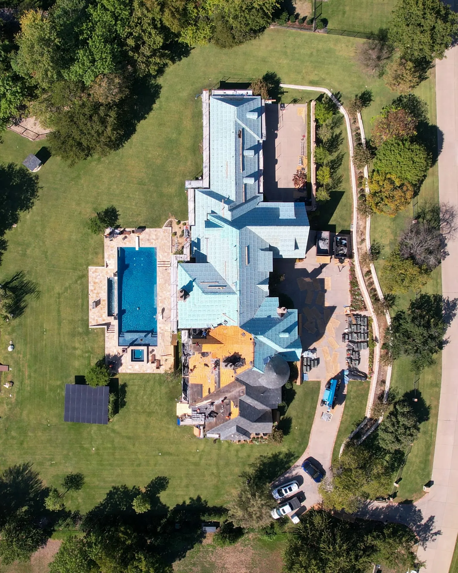 Coppell home with a brick facade and dimensional shingle roof