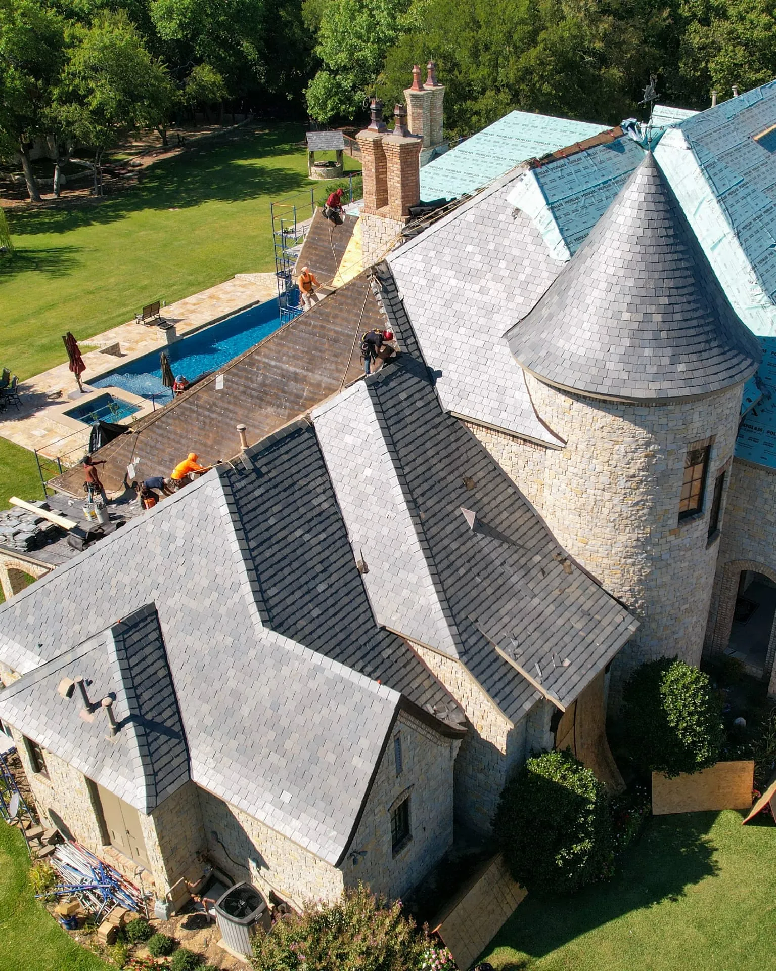 Westlake Texas estate home with a clay tile roof and limestone facade
