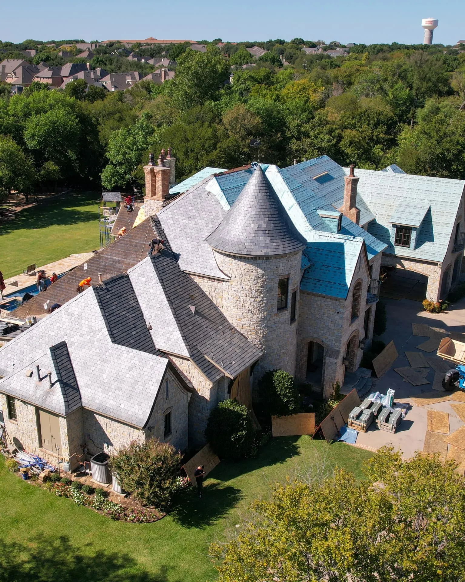 Austin Texas hill country home with a standing seam metal roof and rooftop solar panels