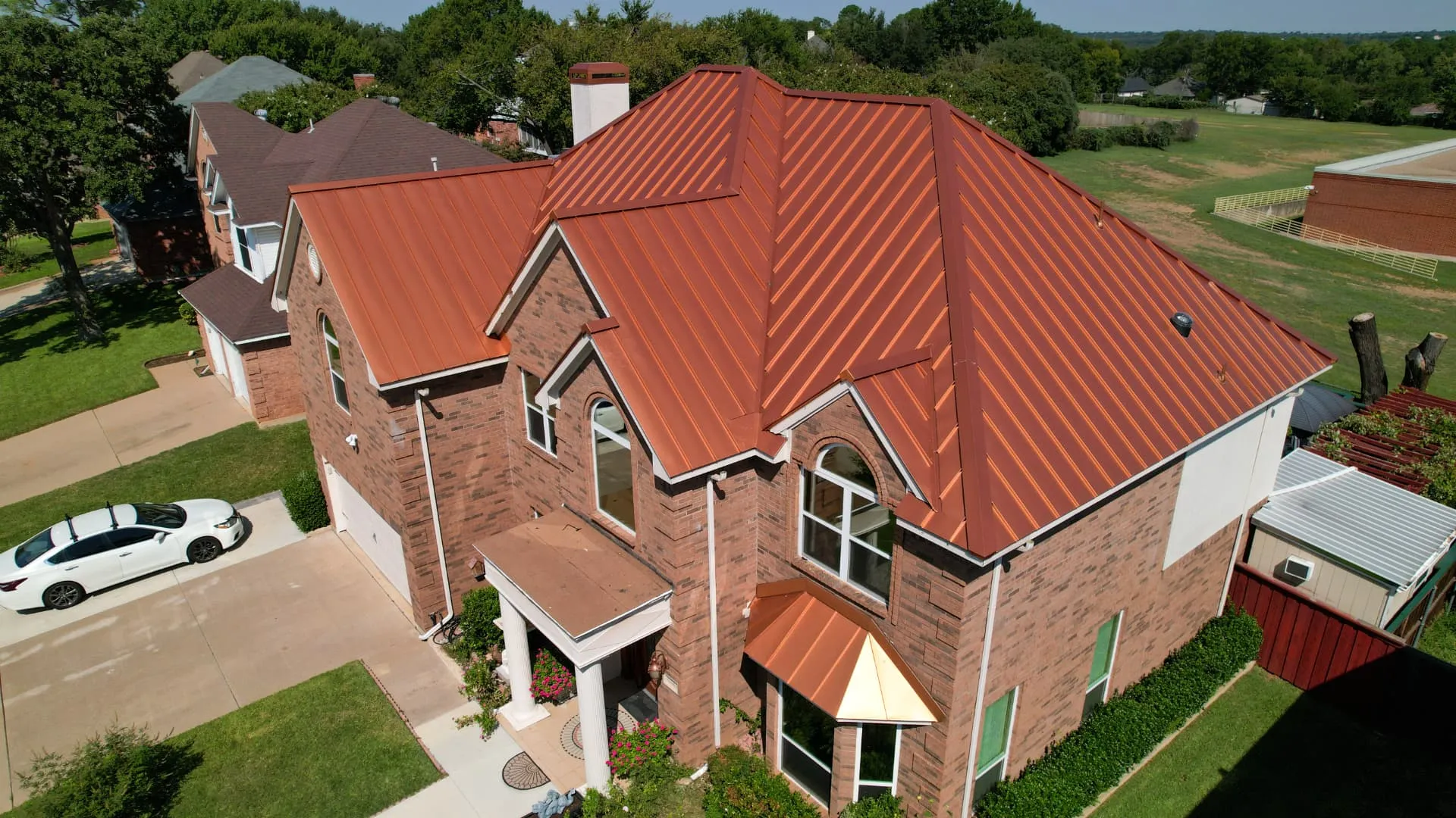 Grapevine, Texas home with mature landscaping and a shingle roof