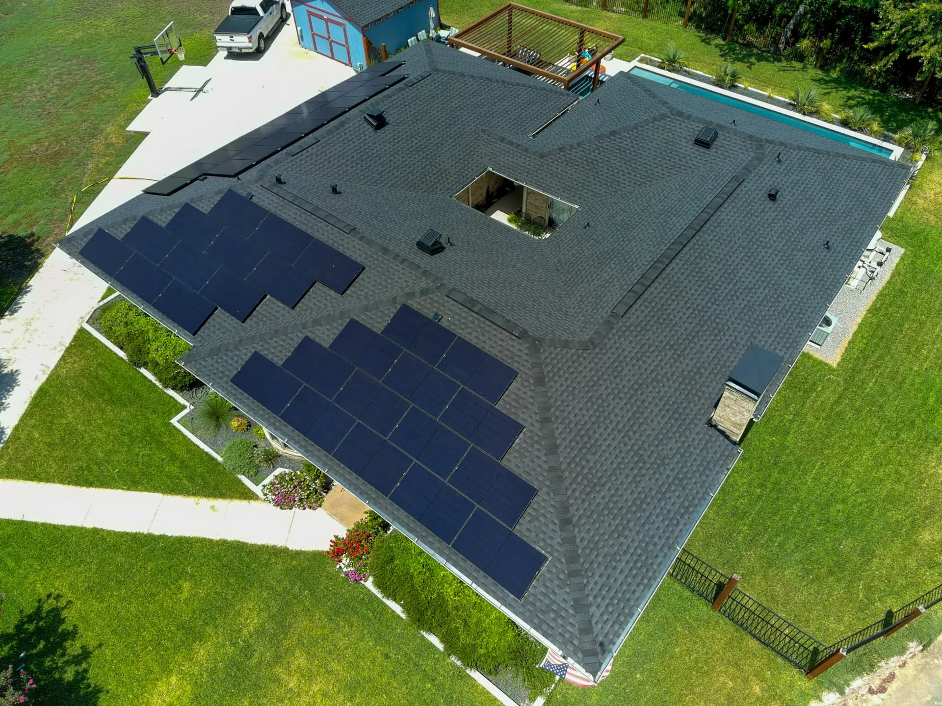 Large Frisco home with a complex roofline and architectural shingles