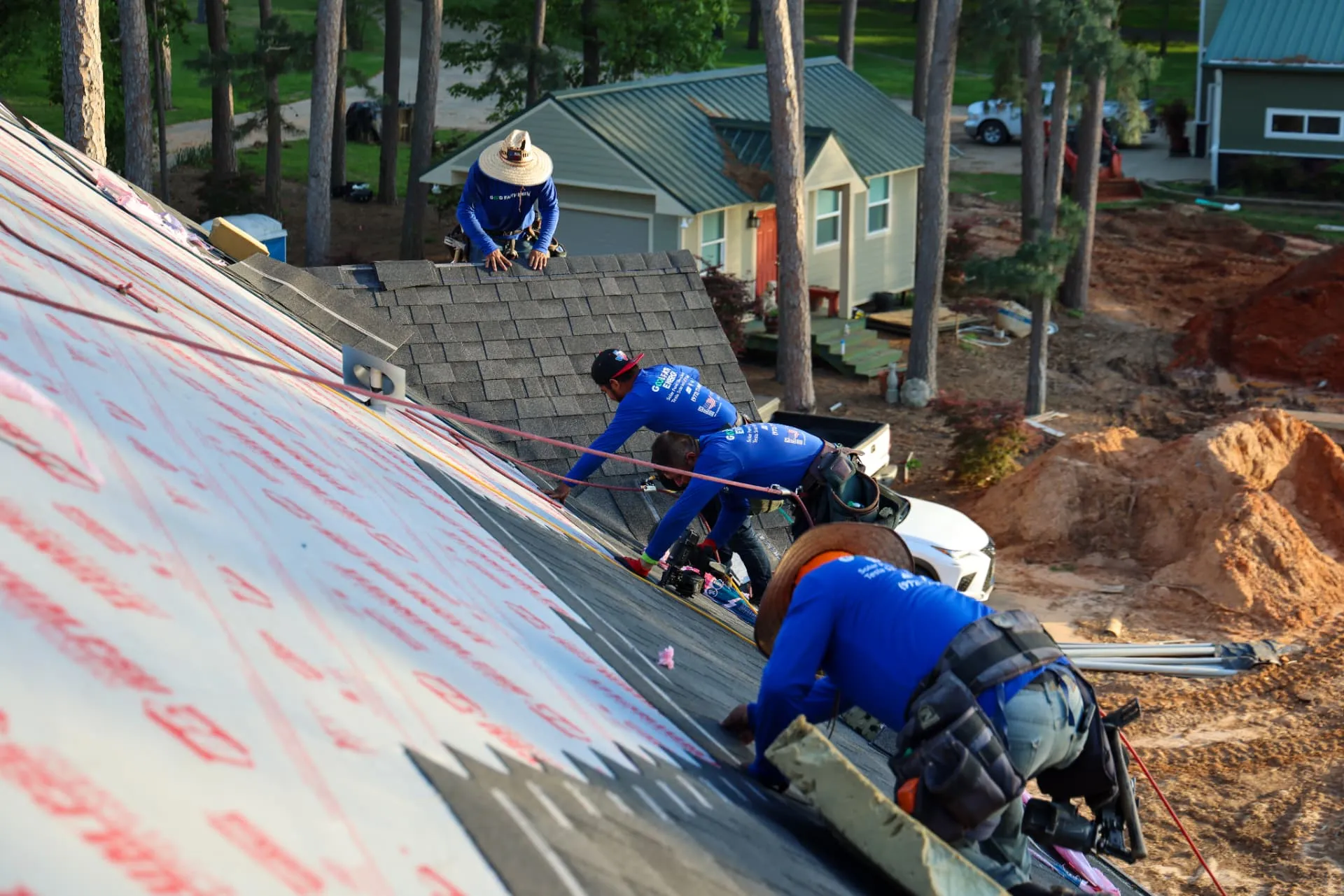 Good Faith Roofing installer fastening new shingles on a North Texas roof